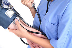 Nurse taking blood pressure