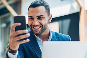 man viewing the benefits of online learning