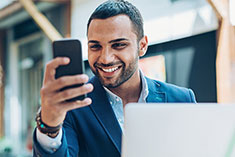 man viewing the benefits of online learning