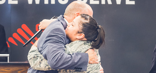 military scholarship recipient hugging president of ctu