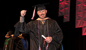 male graduate receiving degree